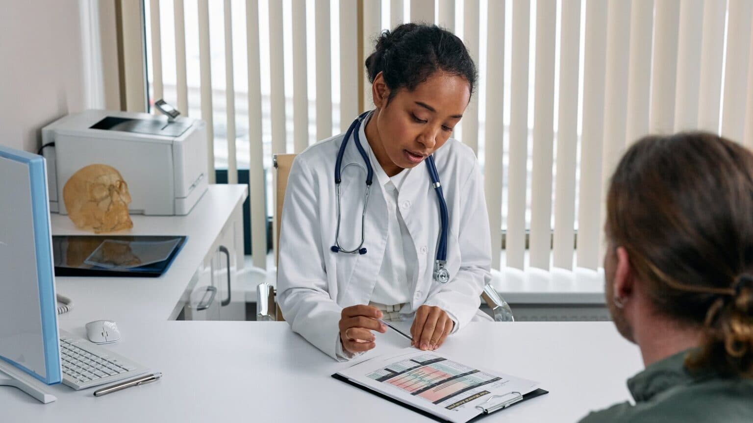 Doctor reviewing ADHD genetic test results with patient